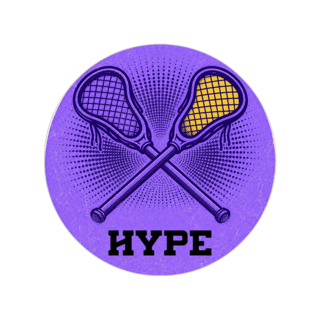 A circular purple graphic featuring crossed lacrosse sticks, one with a yellow head and the other black, with the word 'HYPE' in bold black letters below, on a plain white background.