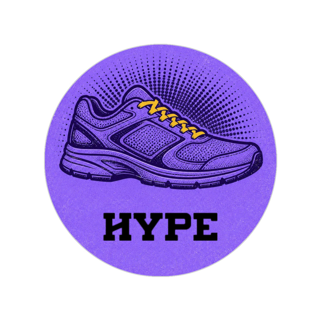 A circular purple sticker or patch featuring a stylized running shoe with yellow laces and the word 'HYPE' in bold black letters below it, shown on a plain white background.