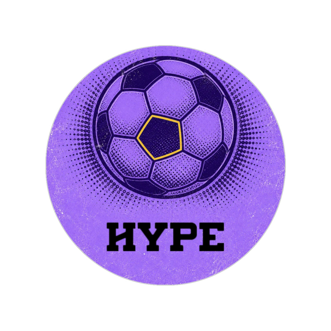 A circular purple graphic featuring a stylized soccer ball with a yellow-outlined center pentagon and the word 'HYPE' in bold black letters below, set on a plain white background.