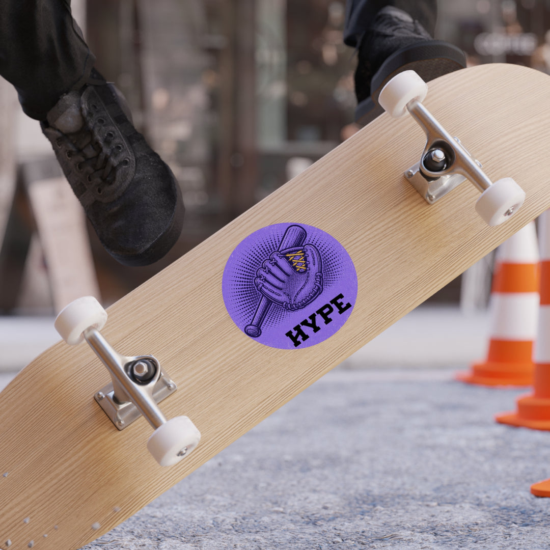 A close-up of a skateboard with a purple circular &
