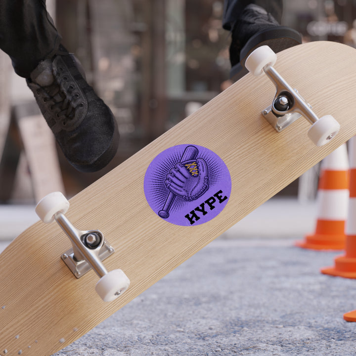 A close-up of a skateboard with a purple circular &