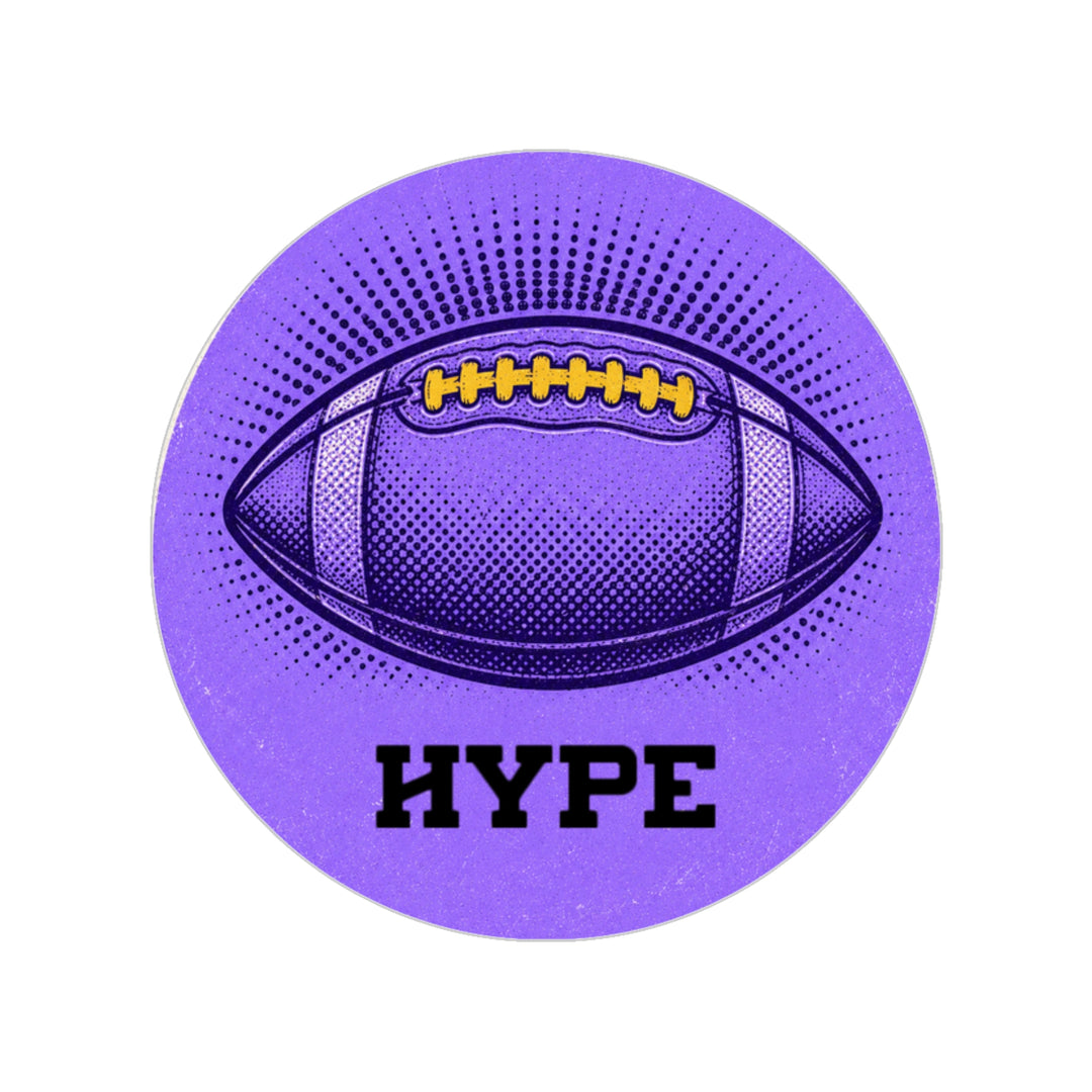 A circular purple sticker or coaster featuring a stylized football graphic with yellow laces, a halftone pattern, the word 'HYPE' in bold black letters, and a subtle glitter texture on a plain white background.
