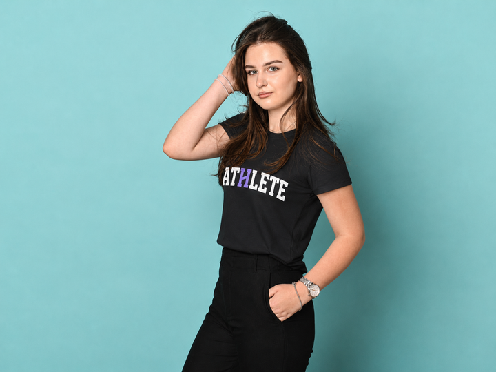 A woman posing in a black short-sleeve t-shirt with &